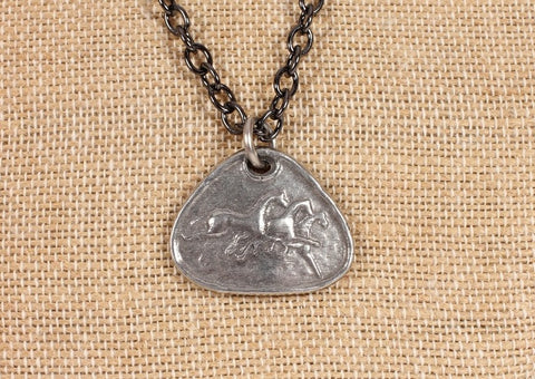 three running horses on hand-cast pewter pendant, in gun metal finish on dark chain